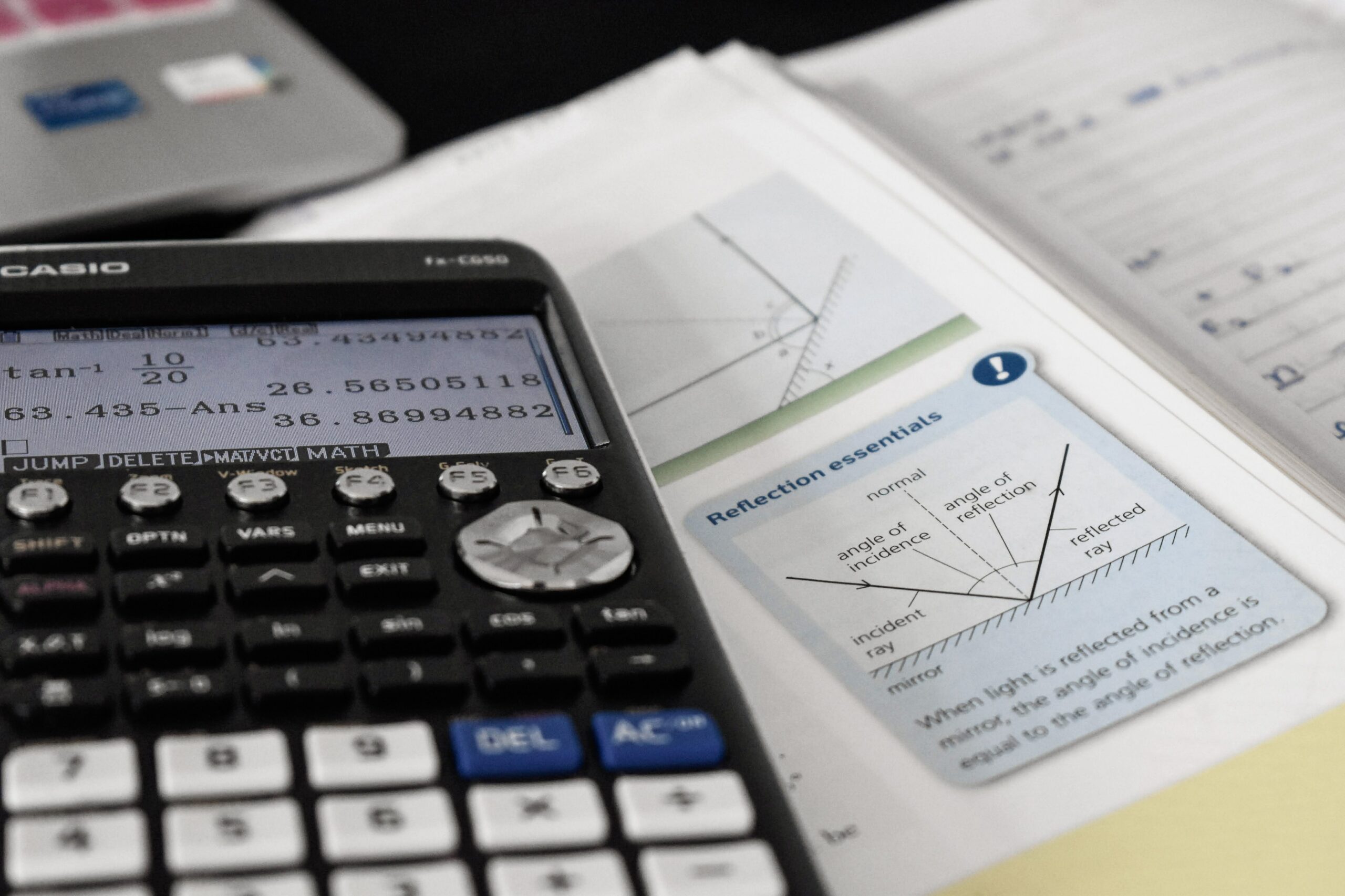 GCSE Physics revision book and a Casio calculator