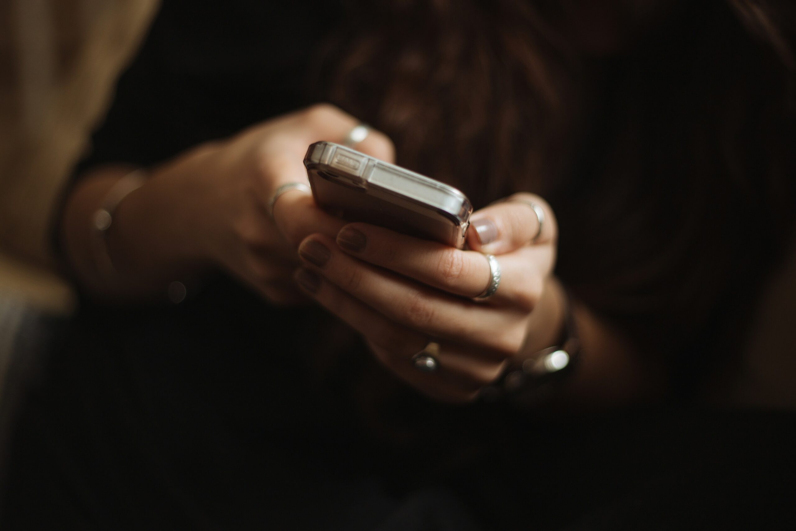 person texting on phone.